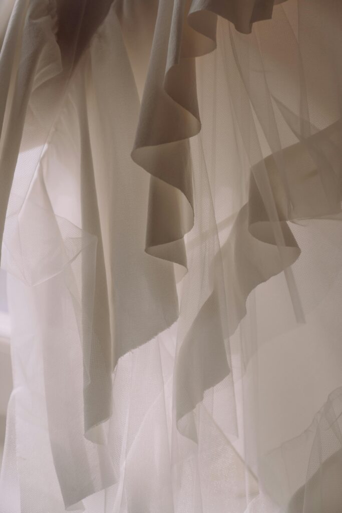 Layers of curtains symbolizing spiritual veils that separate humans from directly perceiving the perfection of God.