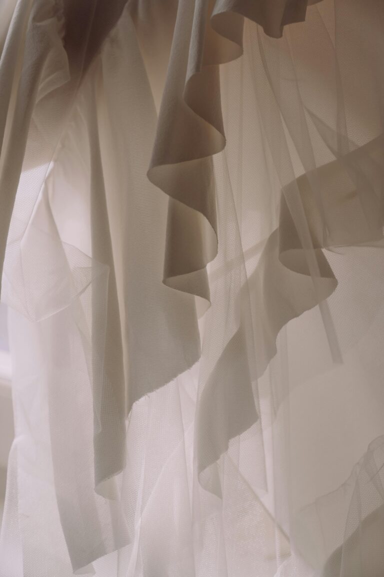 Layers of curtains symbolizing spiritual veils that separate humans from directly perceiving the perfection of God.